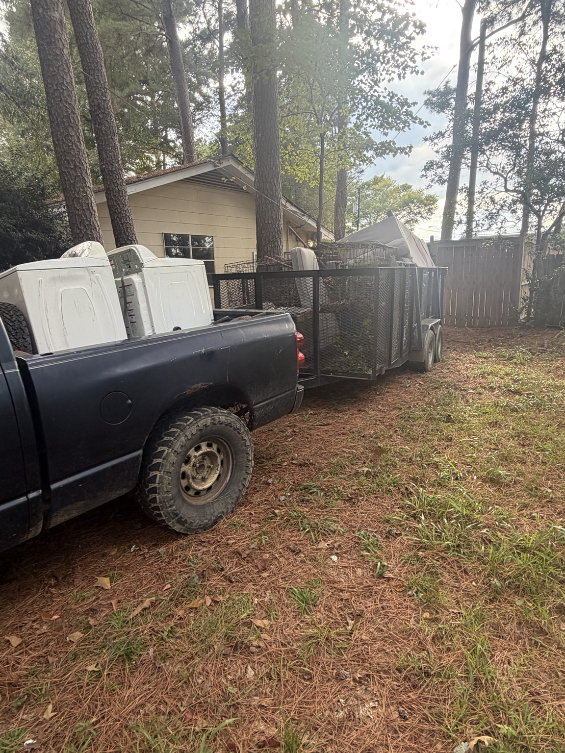 Washer and dryer loaded in a truck for haul-away
