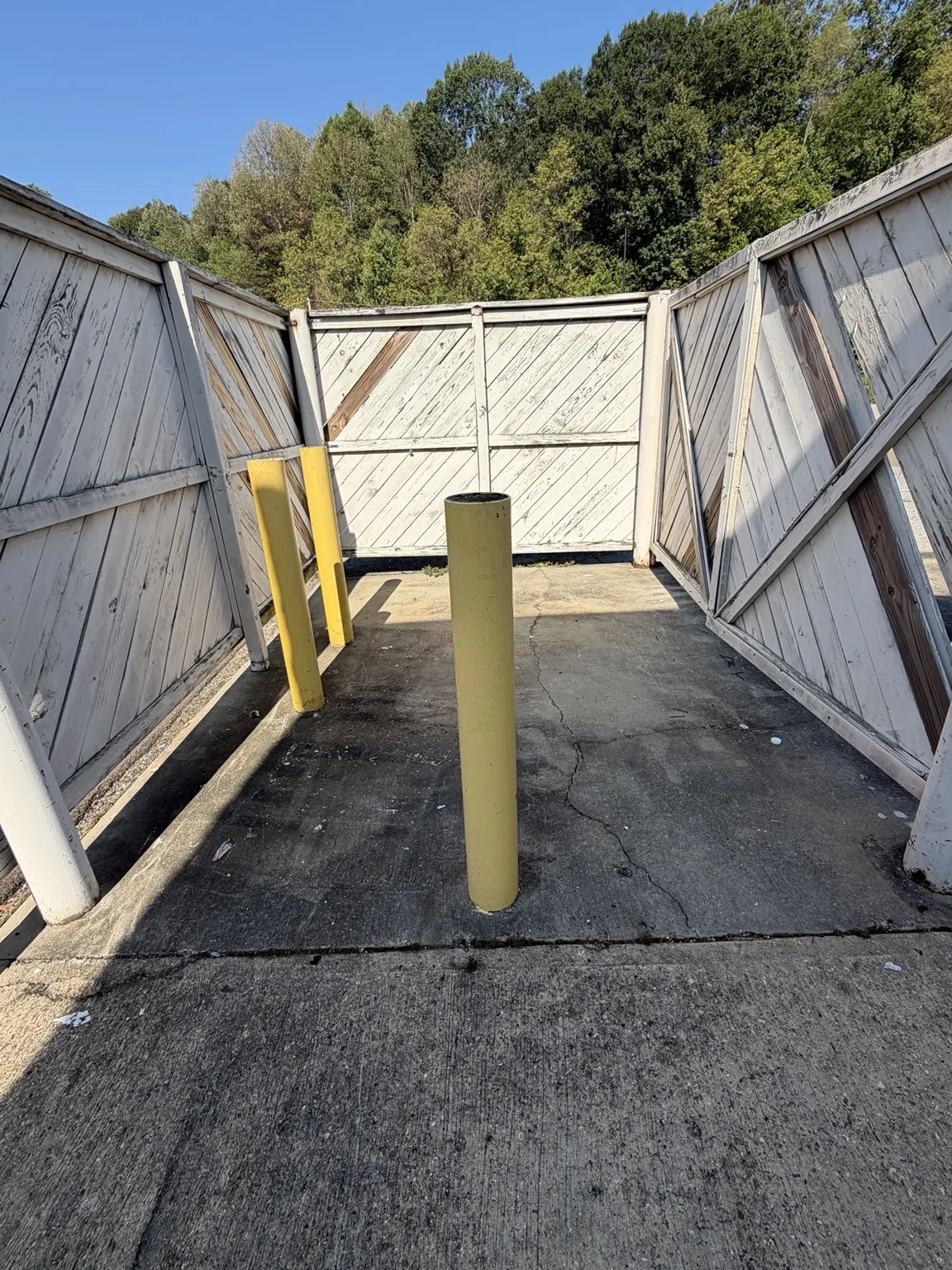 Another view of the cleared concrete pad inside the commercial enclosure
