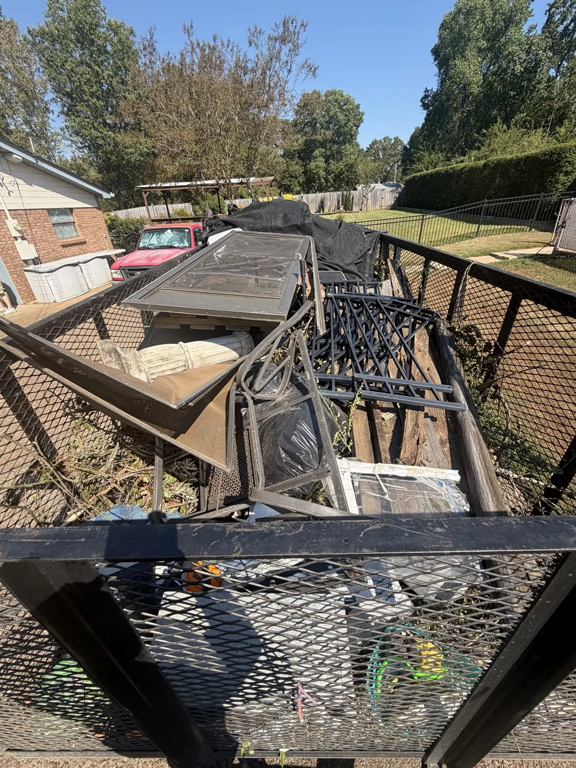 Trailer loaded with assorted bulky items during a Frisco junk removal job