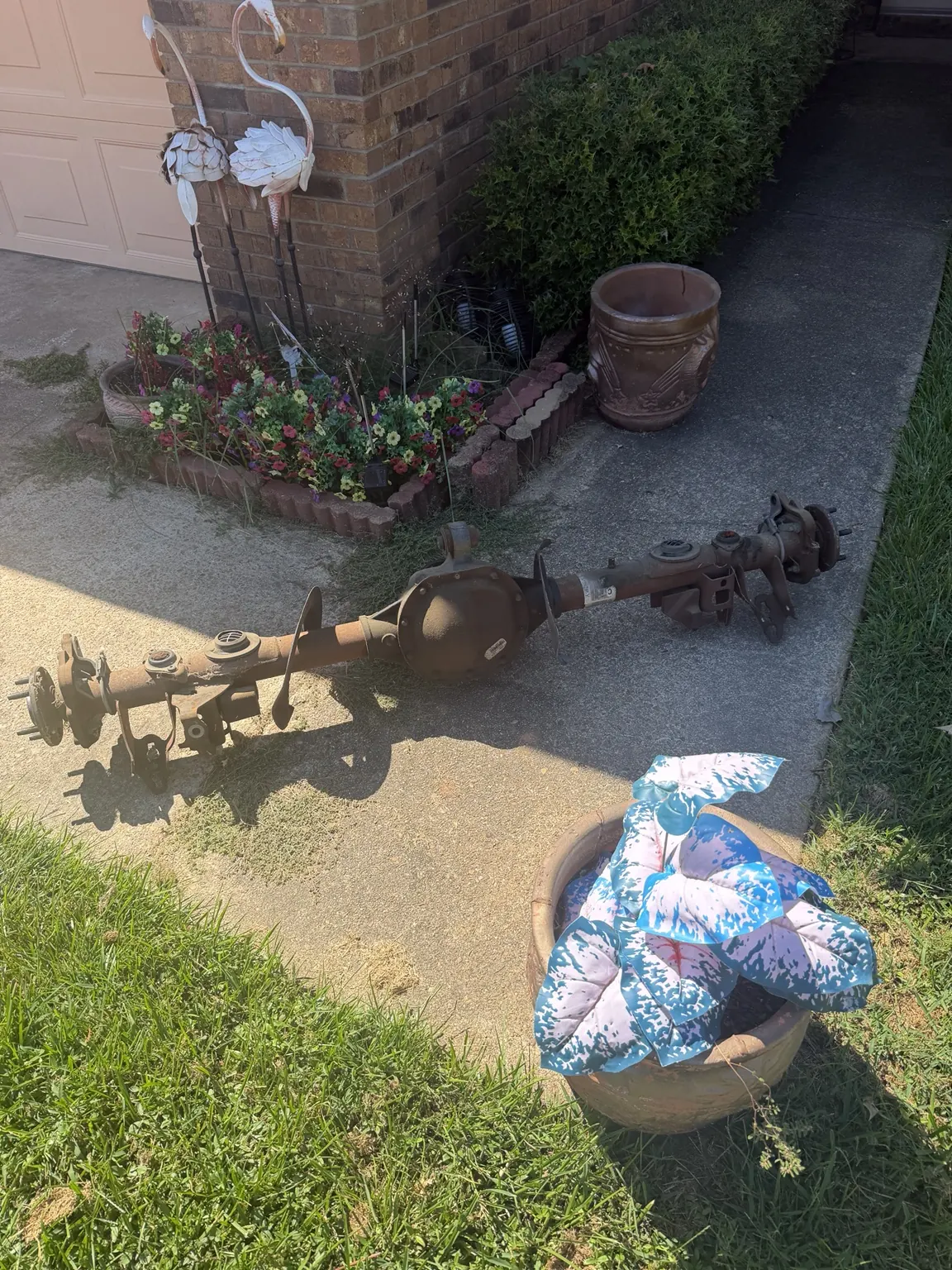 Another view of metal components staged on the driveway