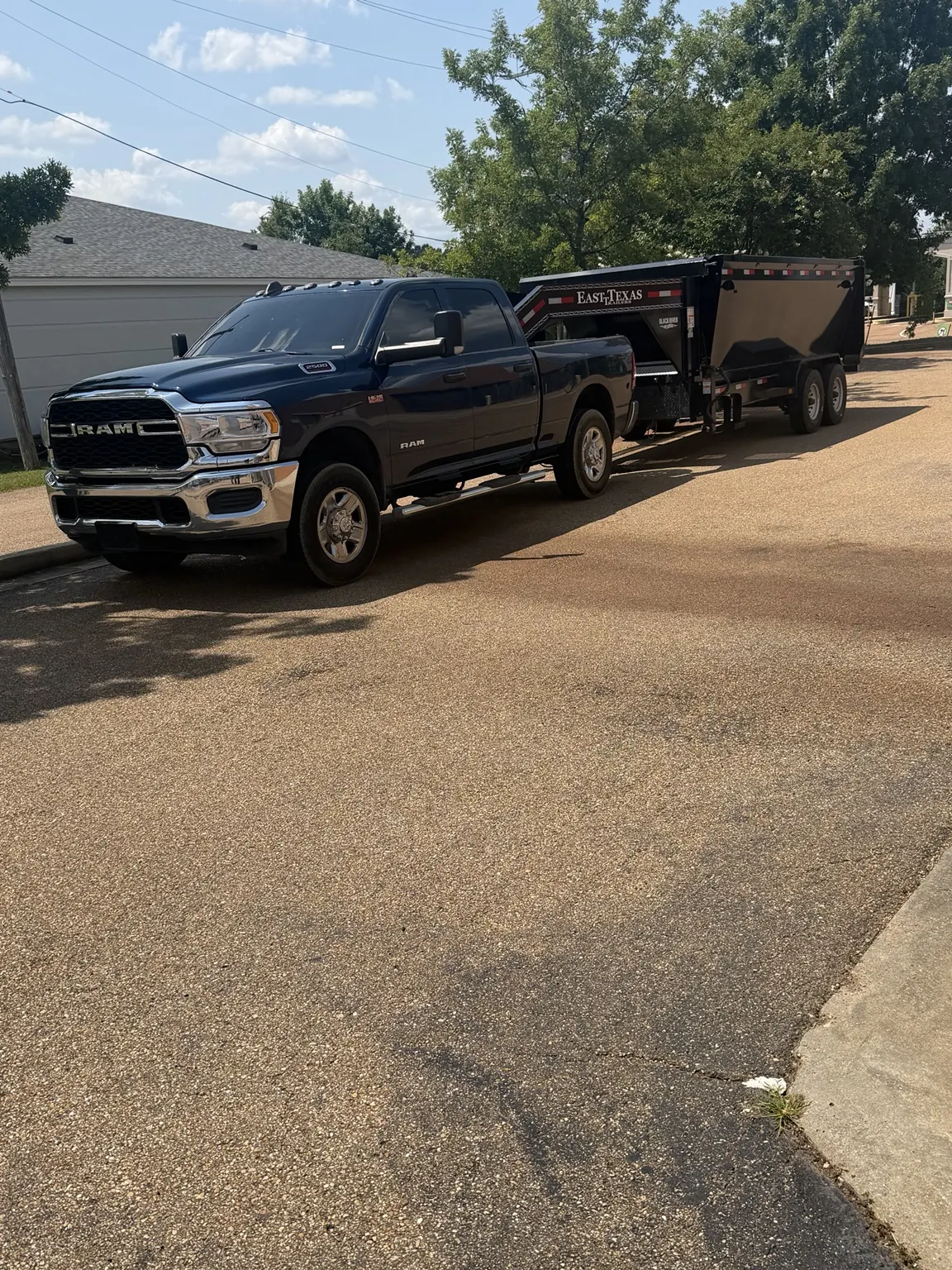 Advanced Junk Removal pickup and dump trailer photographed for the office cleanout