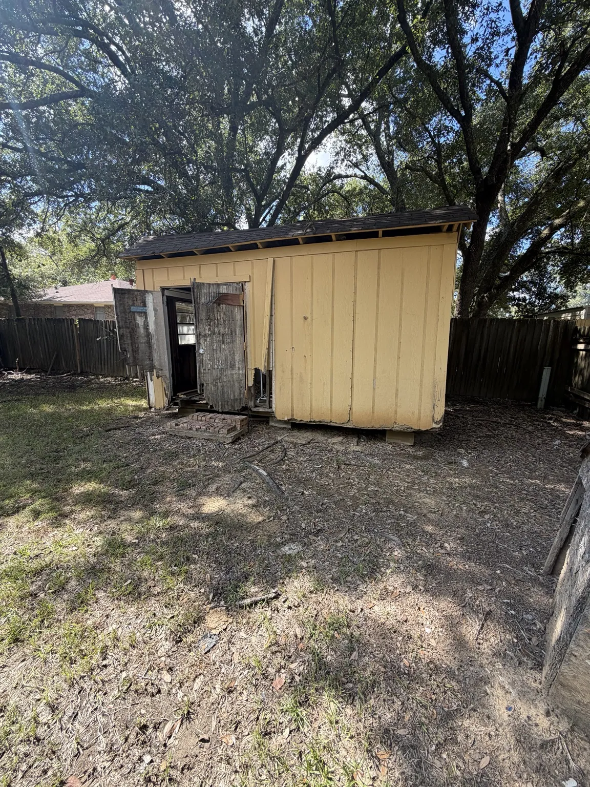 Damaged backyard shed in Frisco before demolition
