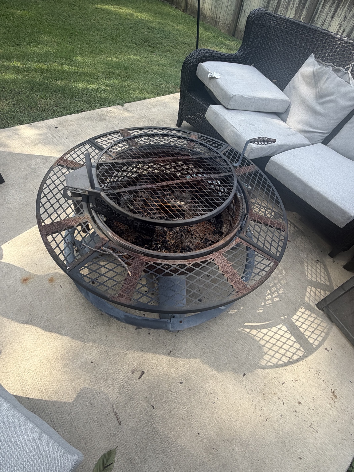 Metal fire pit and outdoor items ready for a junk pickup