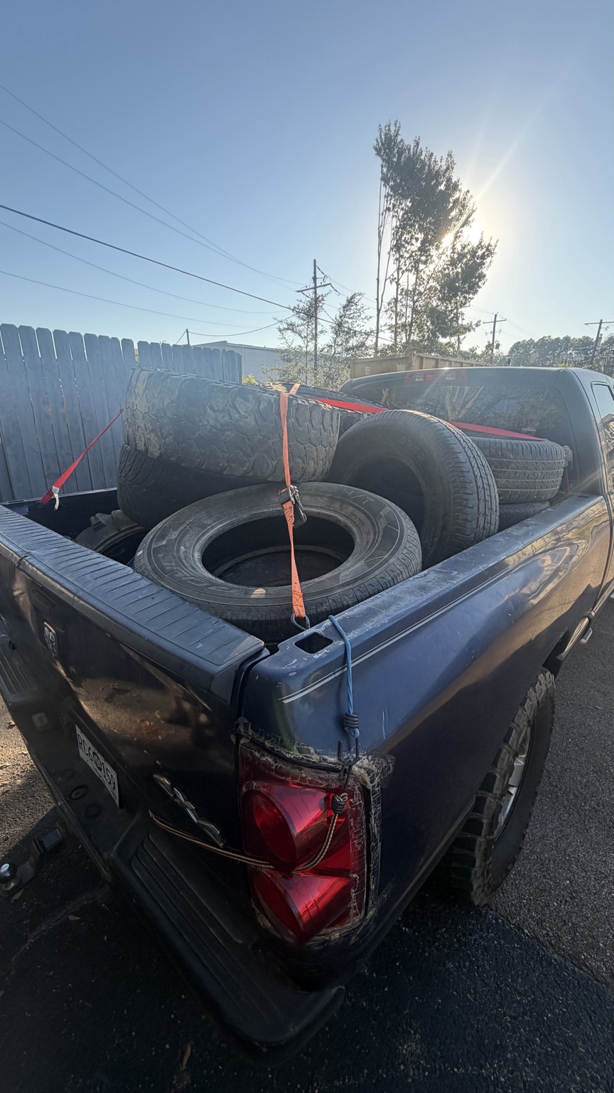Removed tires loaded in a pickup truck