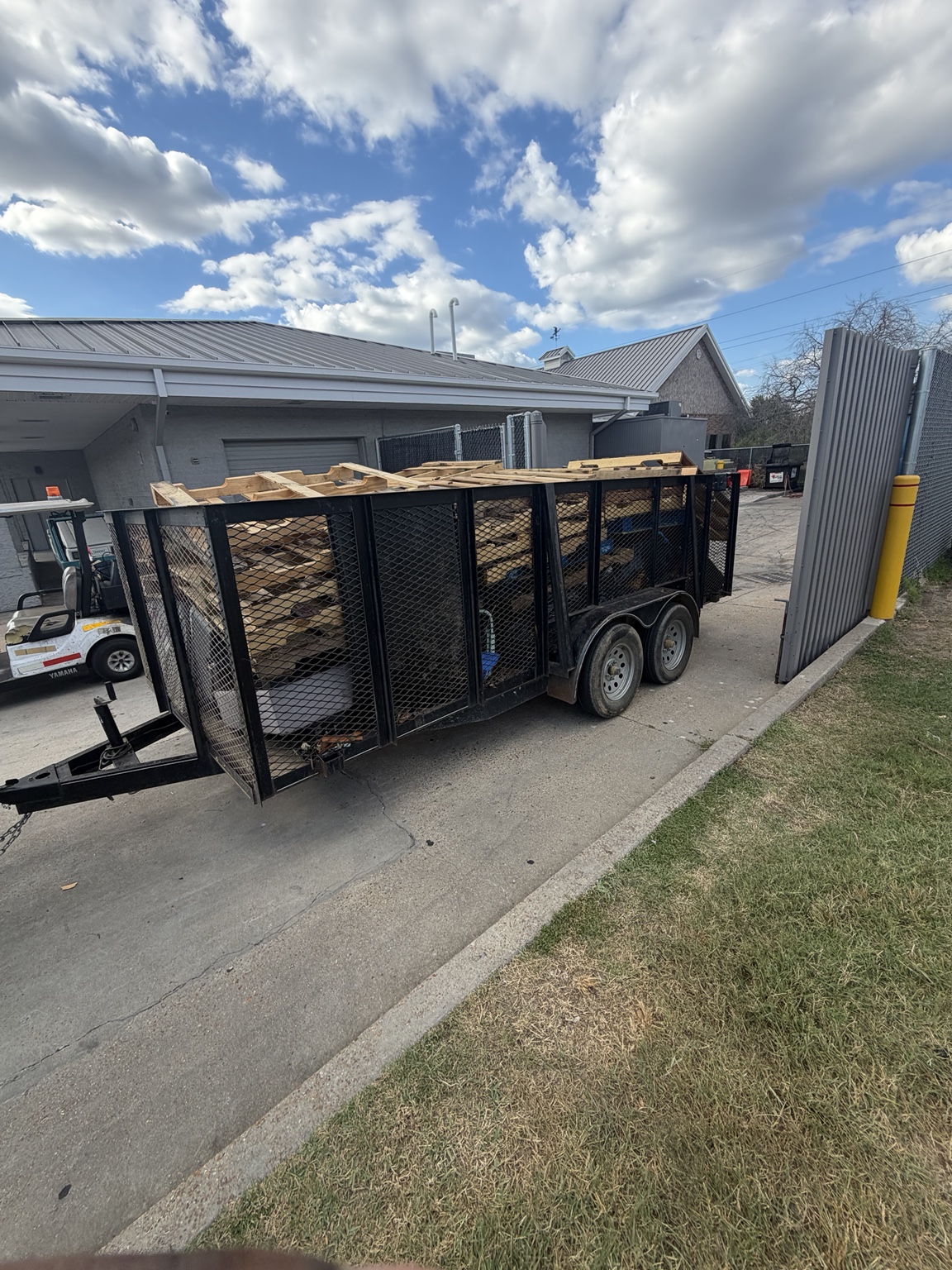 Pallets and wood loaded onto a trailer for removal