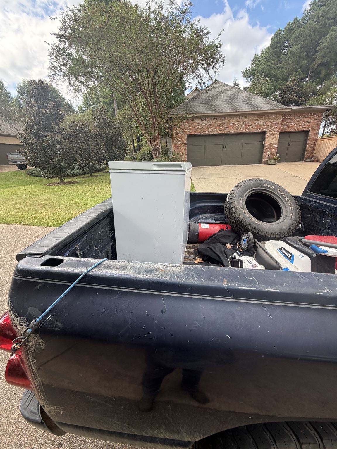 Refrigerator loaded in a truck after removal