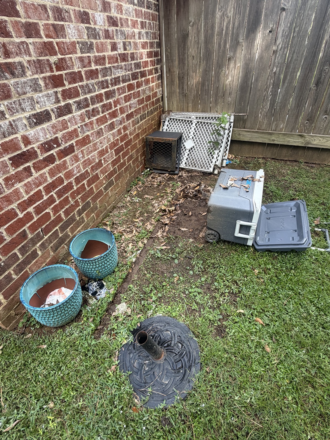 Miscellaneous patio items beside a home