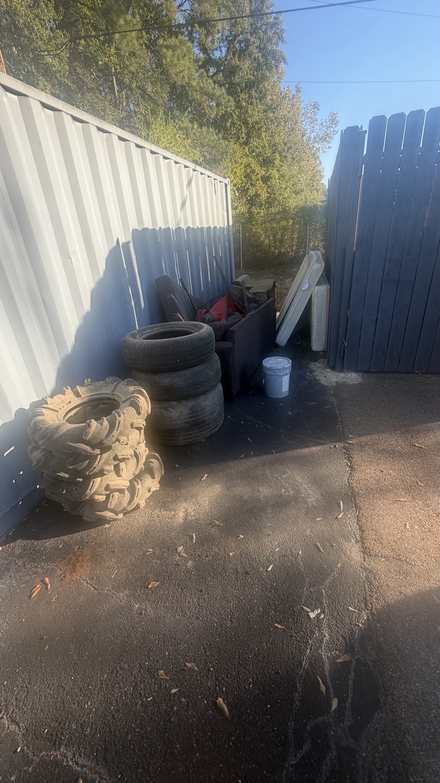 Tire pickup area beside a fence
