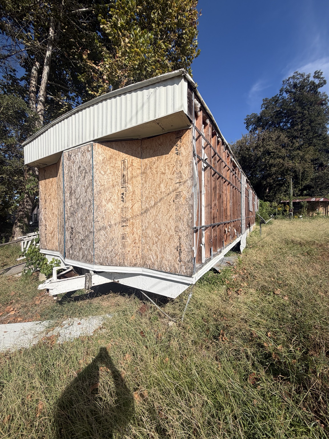 Front of a small shed at the property before demolition