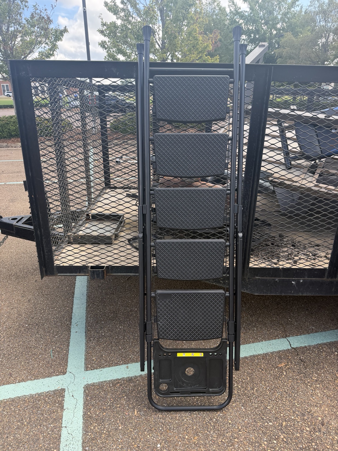 Pool ladder loaded on a trailer during outdoor junk removal