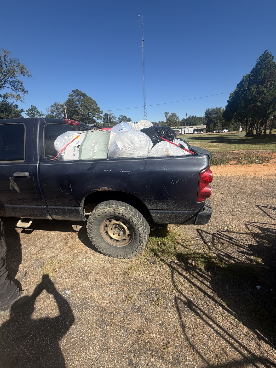 Advanced Junk Removal pickup carrying a commercial debris load